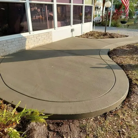 Curved concrete patio with rounded edge
