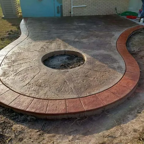 Stamped and colored concrete patio with fire pit