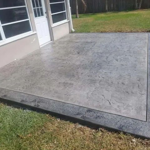 Slate-textured stamped patio in gray